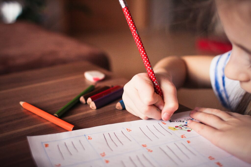 close up of girl writing