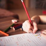 close up of girl writing